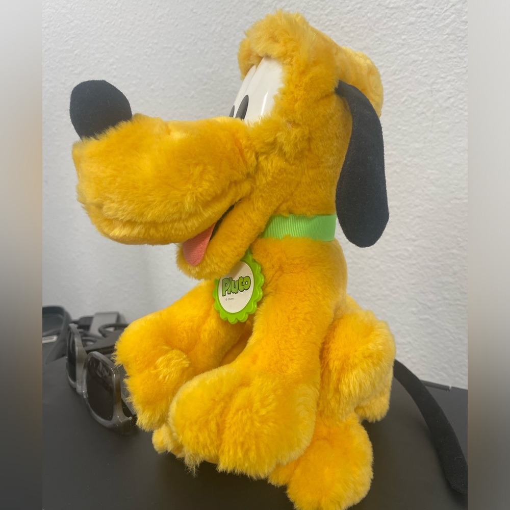 Pluto plushie like new. See pictures before purchasing